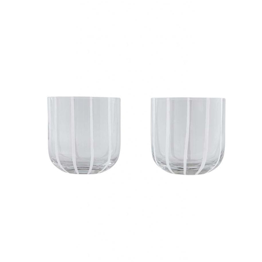Two clear glass tumblers with white striped design on a white background