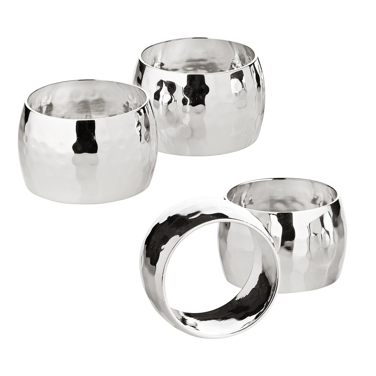 Set of four metal silver napkin rings in a white background