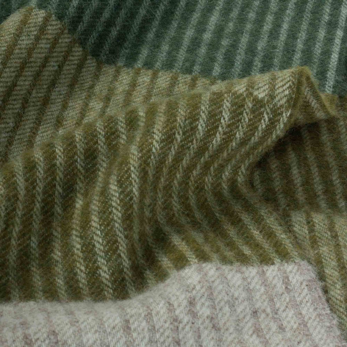 Close-up of textured fabric with green and brown hues