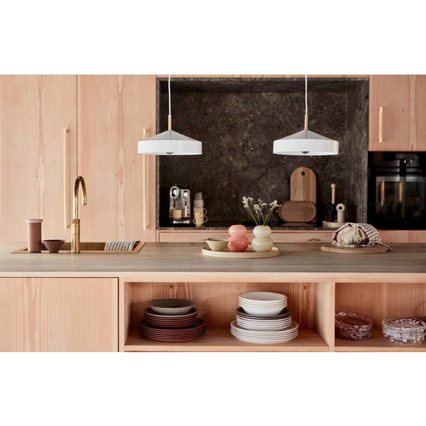 Modern kitchen with wooden cabinets, a countertop, and various kitchen items.