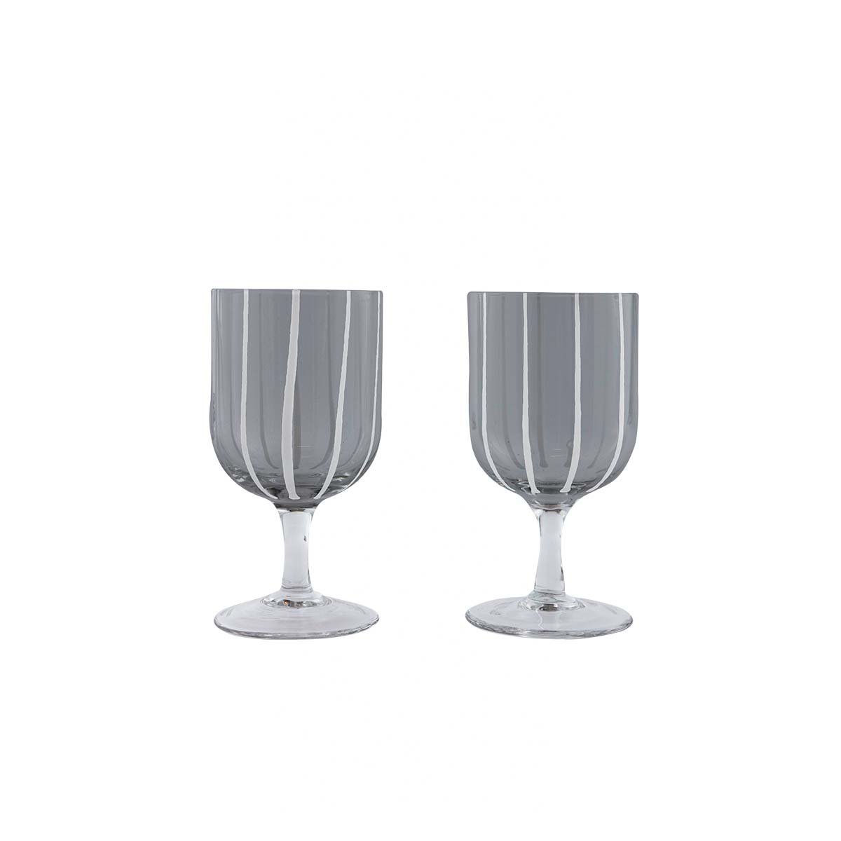 Two gray striped wine glasses on a white background