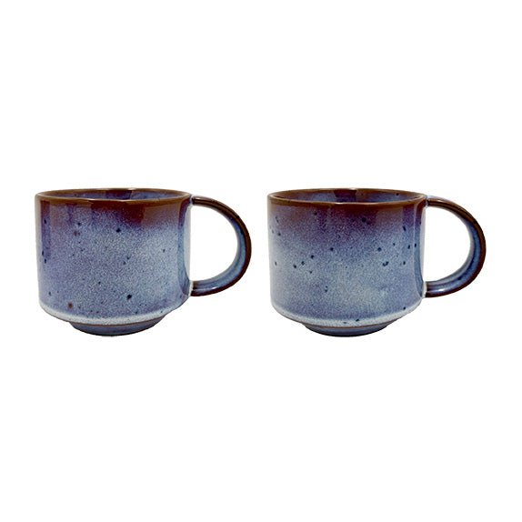 Two ceramic mugs with a speckled design on a white background