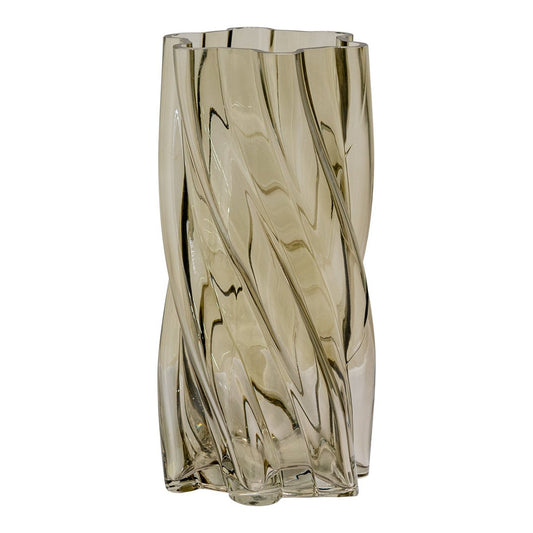 Glass vase with wavy design on a white background