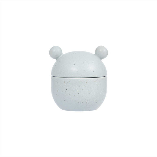 Speckled gray container with a lid on a white background