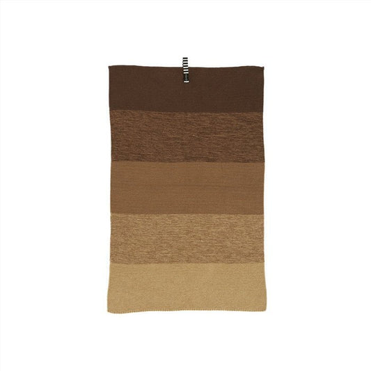 Rectangular knitted kitchen towel with brown and beige stripes on a white background