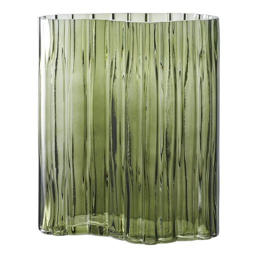 Green glass vase with ribbed texture on a white background