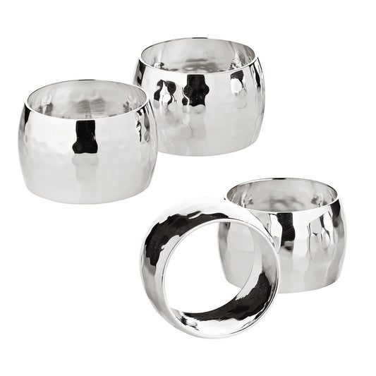 Set of four metal silver napkin rings in a white background