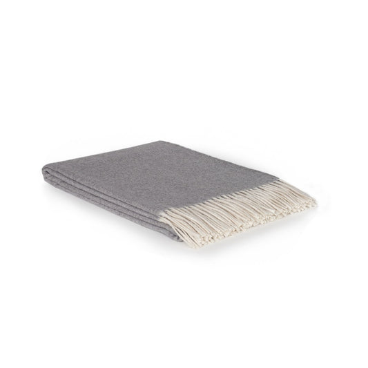 Gray throw blanket with white fringe on a white background