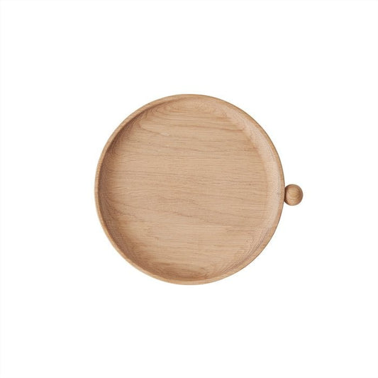 Wooden plate with a small knob on a white background