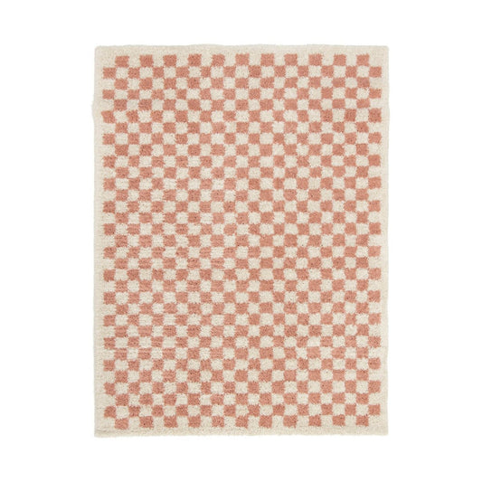 Checkered rug with pink and white pattern on a white background