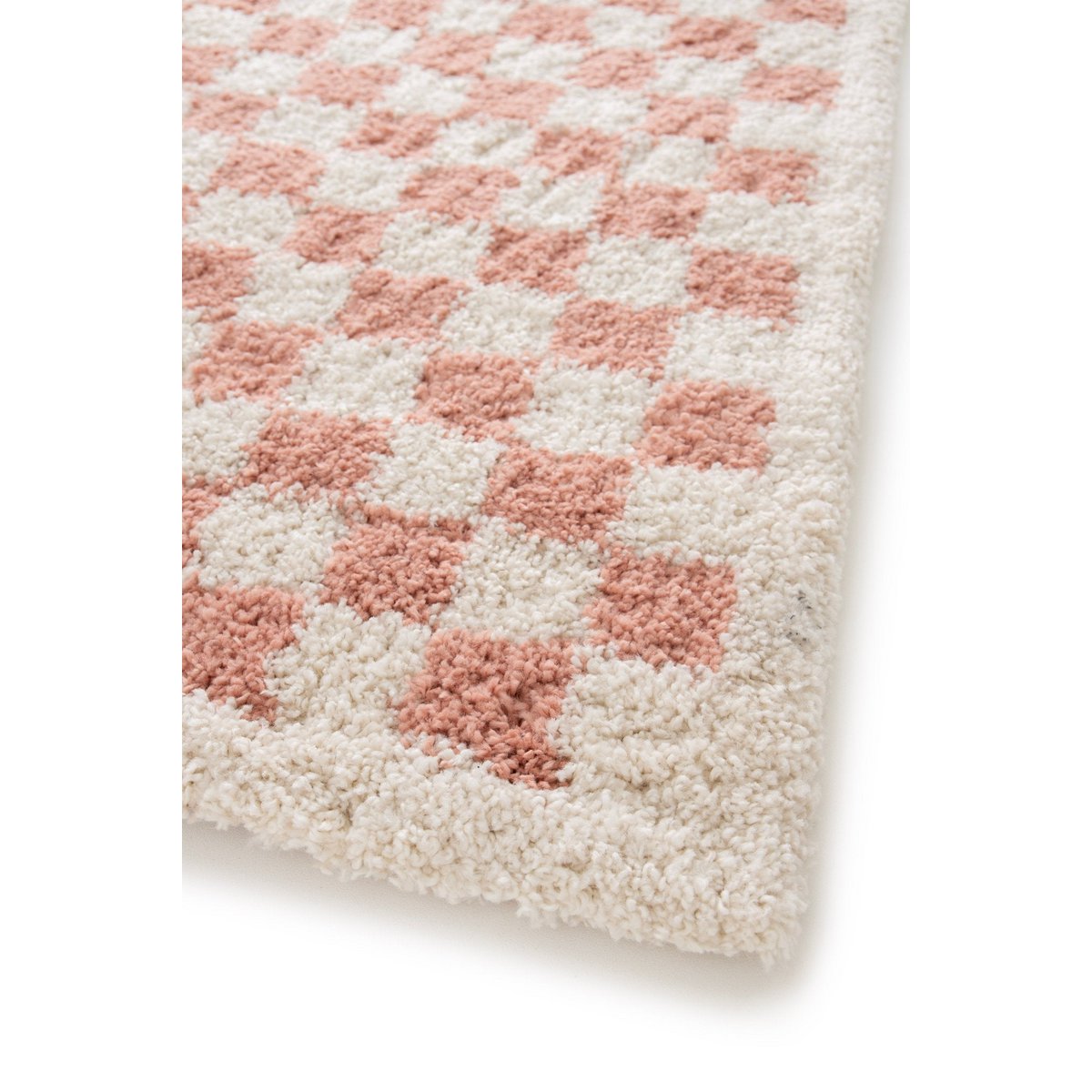 Checkered pink and beige rug on a white background