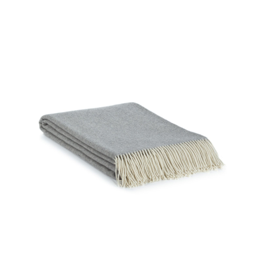 Gray throw blanket with beige fringe on a white background