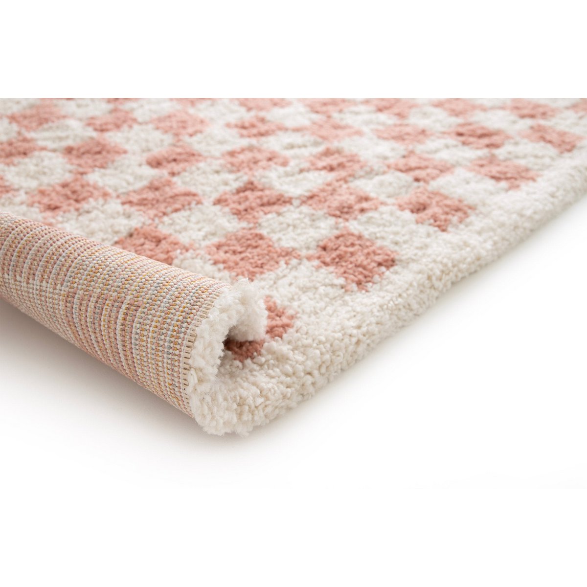 Checkered patterned rug with pink and beige colors on a white background