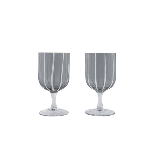 Two gray striped wine glasses on a white background