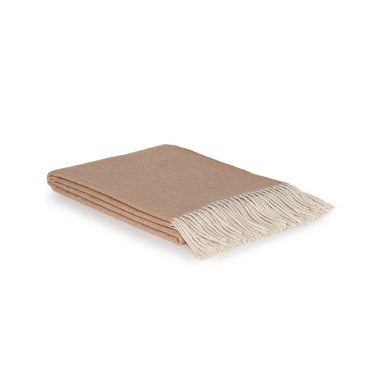 Beige blanket with white fringe on a white background