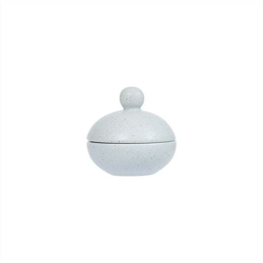 Round ceramic container with a lid on a white background
