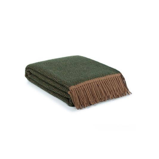Folded green blanket with brown fringe on a white background