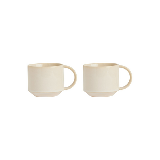 Two beige ceramic mugs on a white background