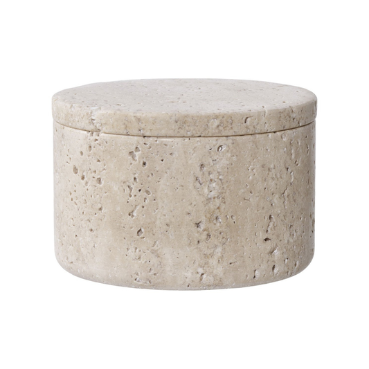 Round stone-textured travertine box with a lid on a white background