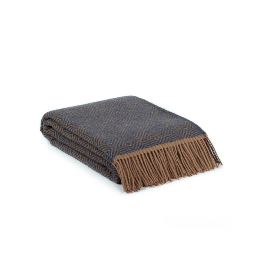 Folded blanket with brown fringe on a white background